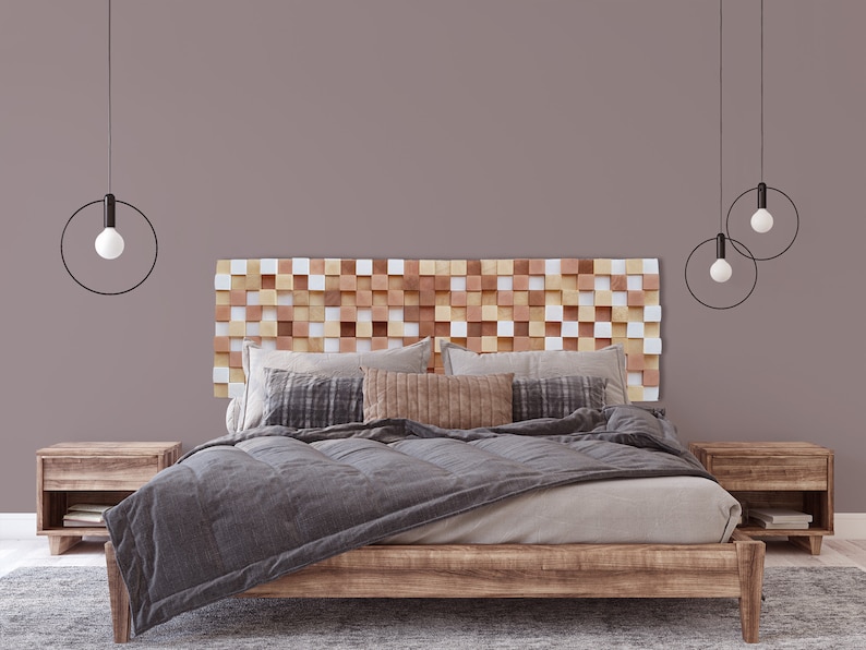May include: A wooden headboard with a geometric pattern in shades of brown, white, and beige. The headboard is behind a bed with a gray duvet and brown wooden nightstands.