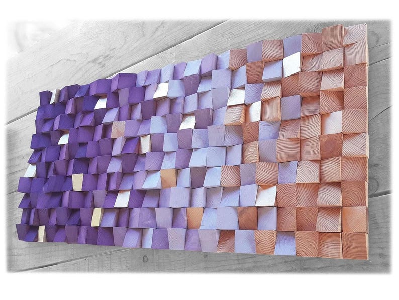a large, colorful, and intricate piece of wall art composed of numerous small, square-shaped wooden blocks in various shades of purple and orange. The blocks are arranged in a visually striking pattern, creating a vibrant and eye-catching display.