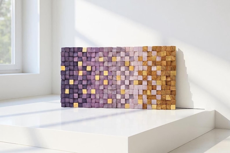 a rectangular wooden wall art piece composed of small square tiles in various shades of purple and brown, arranged in a grid-like pattern.