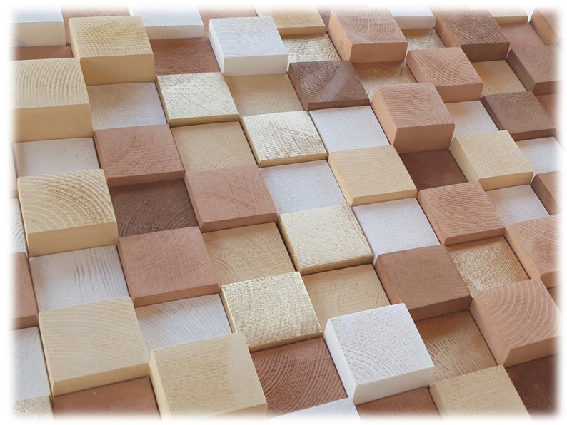 May include: A wall art piece made of various sized wooden blocks in shades of brown, beige, and white. The blocks are arranged in a staggered pattern, creating a textured and visually appealing design.