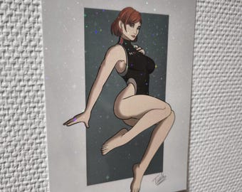 May include: A print featuring a stylized illustration of a woman in a black bodysuit with red hair. The artwork is set against a dark blue background with white stars. The print has a white border with glitter.