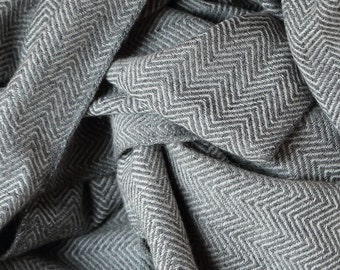 Throw blanket, knitted of noble cashmere. A soft luxury bedding in minimalist style. Reversable, looks different every day