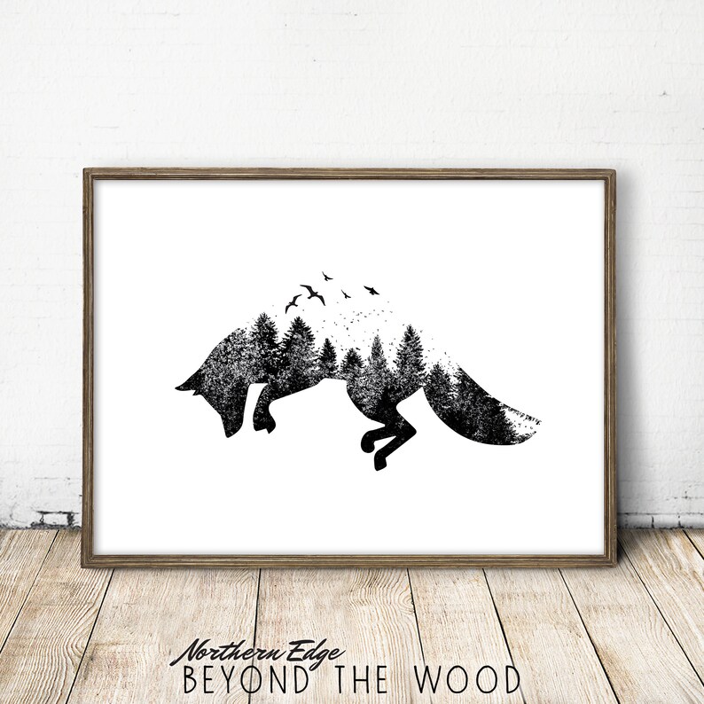 May include: Black and white art print featuring a leaping fox silhouette filled with a forest scene and birds. The artwork is framed in a wooden frame and set against a white background. The text "Northern Edge BEYOND THE WOOD" is at the bottom.