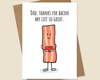 May include: A white card with the text "Dad, thanks for bacon my life so great."  A cartoon drawing of a smiling piece of bacon holding a red heart.