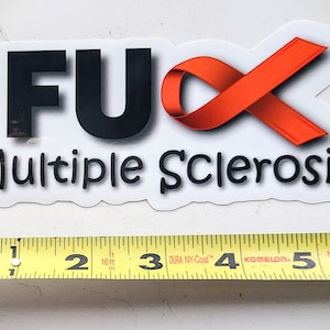 May include: A white sticker with black text that reads "F**K Multiple Sclerosis" and a red ribbon.