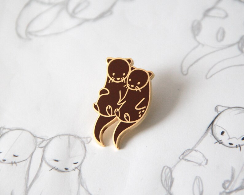 Otters Holding Hands Enamel Pin 