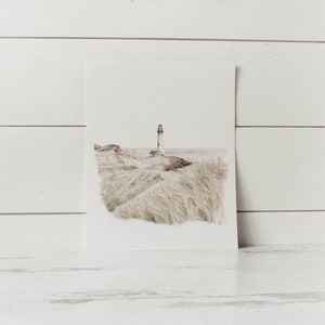 May include: A watercolor painting of a lighthouse on a grassy hill with the ocean in the background.