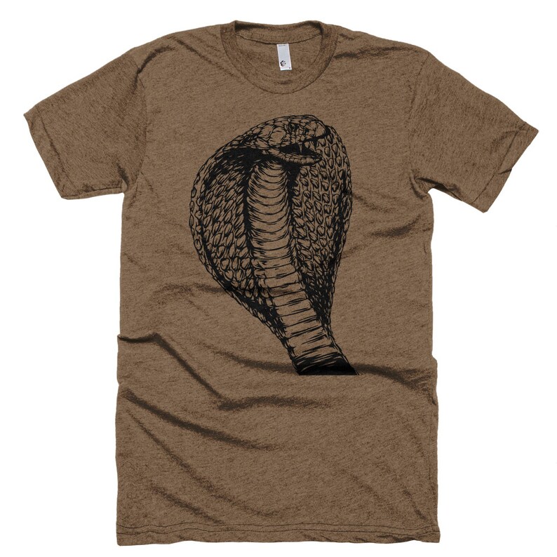 May include: A brown t-shirt with a black graphic of a cobra with its hood raised.