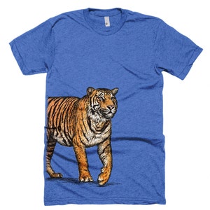 May include: A blue t-shirt with a graphic of a tiger walking to the right. The tiger is orange and black with white stripes.