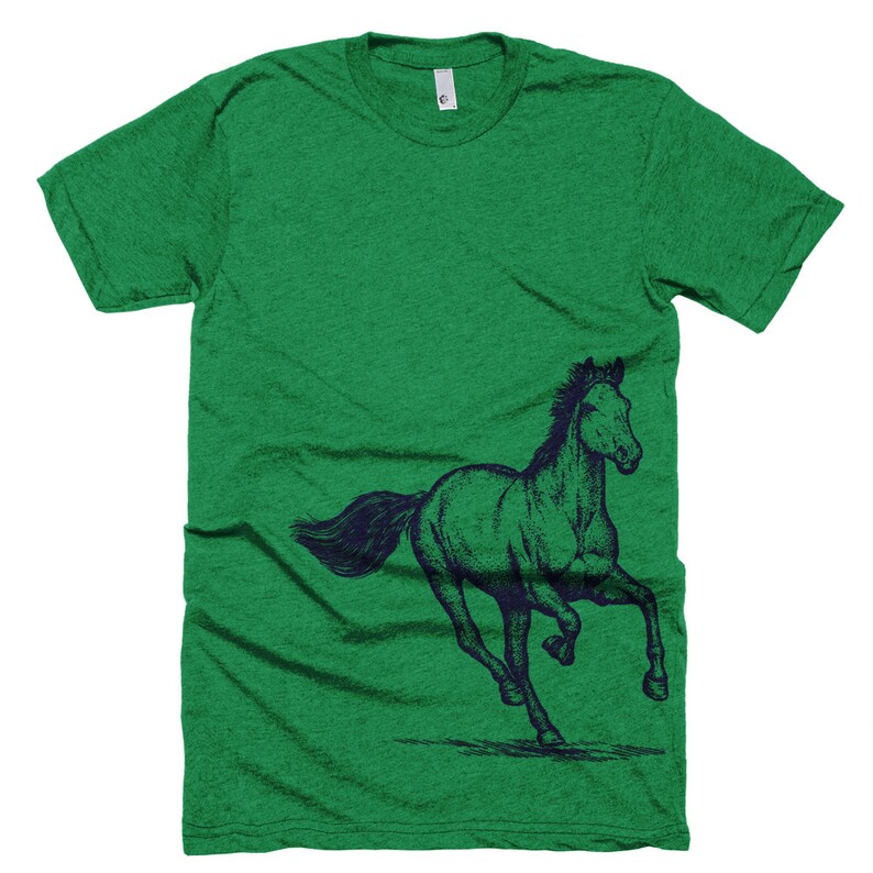 May include: A green t-shirt with a navy blue illustration of a horse running on the left side of the shirt.