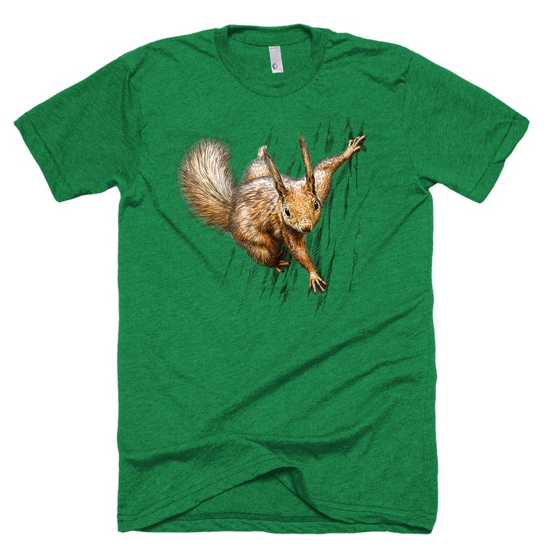 May include: A green t-shirt with a graphic of a squirrel peeking out from behind a tree trunk.
