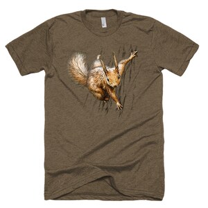 May include: A brown t-shirt with a graphic of a squirrel peeking out from behind a tree trunk.