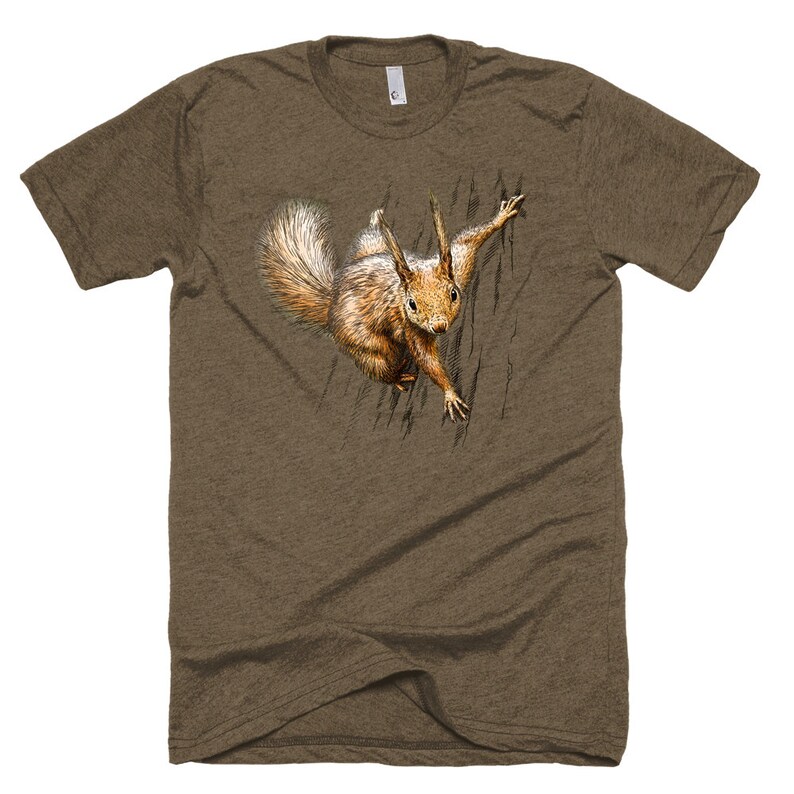 May include: A brown t-shirt with a graphic of a squirrel peeking out from behind a tree trunk.