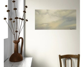 May include: A painting of a cloudy sky in shades of gray and white, hanging on a white wall in a room with a vase of dried flowers and a wooden chair.