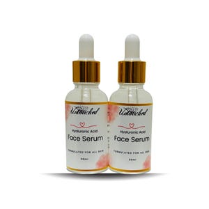 May include: Two clear glass bottles of face serum with white droppers and gold-colored collars. Each bottle has a label with the text "Untouched", "Hyaluronic Acid Face Serum", and "FORMULATED FOR ALL SKIN". The bottles are 30ml each.
