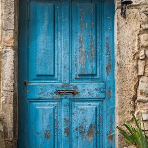 Photo of old turquoise door in France