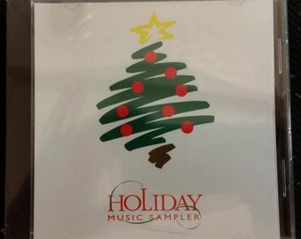 1997 Holiday Sampler CD from holiday best buy game crate Promotion. Rare Never opened Game Create Promotion Track list is on the back side.