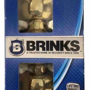 May include: A package for a Brinks interior locking door knob. The package is blue and features a gold door knob with a lifetime warranty. The text on the package reads "Brinks, A Trusted Name in Security Since 1859, Heavy Duty, EZ2NSTALL, Interior Locking, Ideal for Bed & Bath".