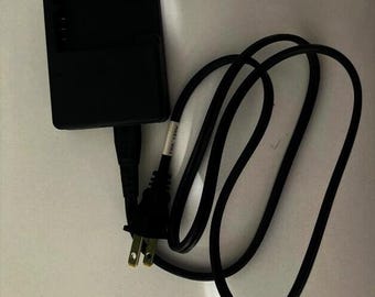 Caricabatterie per batterie agli ioni di litio Technics-GP TC03G-2U025-0421D, 4,2 V, 0,6 A. Può essere utilizzato per batterie agli ioni di litio Fuji NP-120 e per molti altri modelli.