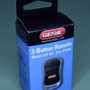 May include: A blue and black package for a Genie 3-button garage door remote. The package has the text "Genie Professional Line" and "3-Button Remote" on it. The model number is G3T-BX and the part number is 37218R.