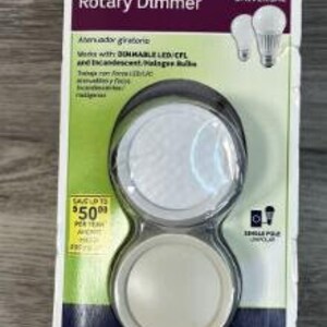 May include: A Leviton trimatron rotary dimmer switch with a white and light almond knob. The packaging says it works with dimmable LED, CFL, and incandescent bulbs. It is universal and single pole.