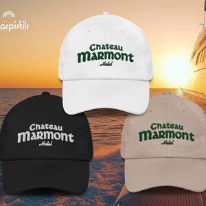 May include: Three baseball caps with the text "Chateau Marmont Hotel" embroidered in green on the front. The caps are white, black, and beige.
