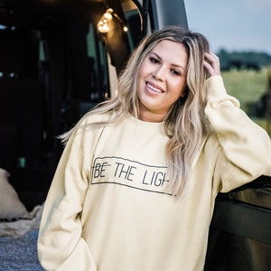 Be the light sweatshirt yellow sales