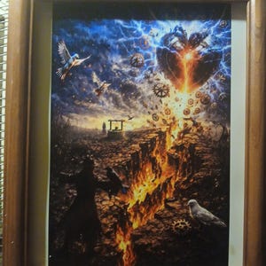 May include: Framed artwork featuring a surreal landscape with a fiery chasm and a heart-shaped structure in the sky. The artwork includes birds, gears, and a figure in silhouette, all set against a dramatic blue and orange sky. The frame is made of wood.