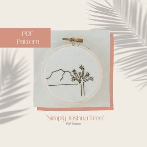 May include: A white embroidery hoop with a black line drawing of a Joshua tree and a mountain range. The text "Simply Joshua Tree" and "PDF Pattern" is below the hoop.