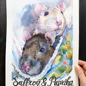 May include: Watercolor painting of two rats, one white and one black, with the names Saffron & Paprika written below.