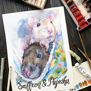 May include: Watercolor painting of two rats, one white and one gray, with the names "Saffron & Paprika" written below them.