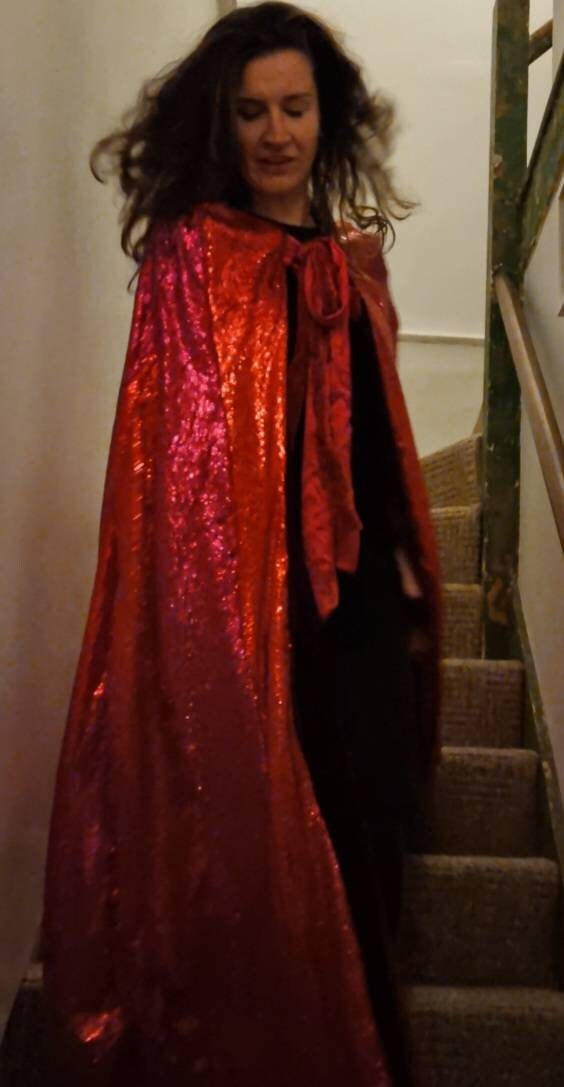 red sequin cape