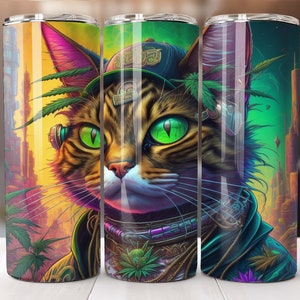 May include: A stainless steel tumbler with a digital art design of a cat with green eyes, wearing a hat and futuristic accessories. The cat is surrounded by cannabis leaves and a cityscape background.