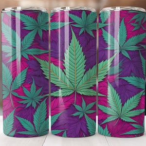 May include: Three stainless steel tumblers with a colorful cannabis leaf pattern. The tumblers are purple, pink, and green.