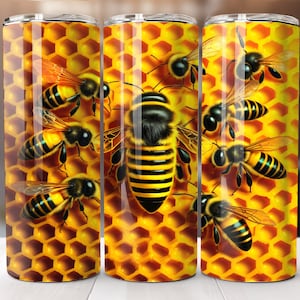 May include: Three stainless steel tumblers with a honeycomb pattern and bees. The bees are yellow and black with brown eyes. The tumblers are a great way to keep your drinks cold or hot.