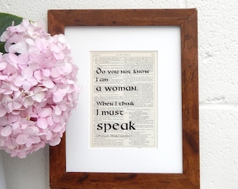 May include: A framed print with a quote from William Shakespeare that reads "Do you not know I am a woman. When I think I must speak."