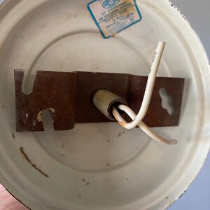 May include: White ceiling fixture with a metal bracket and two wires. The fixture has a label that reads "XTURE IC THOMAS INDUSTRIES INC HOPKINSVILLE, KY. MADE IN USA".
