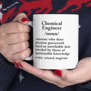 May include: White ceramic mug with a black and white definition of a chemical engineer. The definition reads: "someone who does precision guesswork based on unreliable data provided by those of questionable knowledge. See also: wizard, magician."