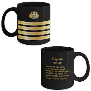May include: Black ceramic coffee mug with a gold and black design of a captain's rank insignia and the definition of the word "captain".