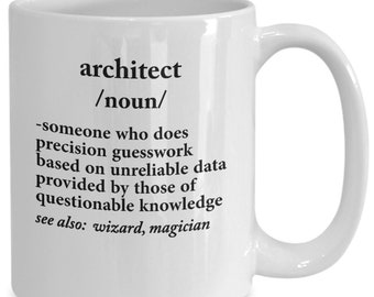 May include: White ceramic mug with a humorous definition of "architect" printed in black. The definition includes the words "precision guesswork" and "questionable knowledge". The mug has a curved handle.