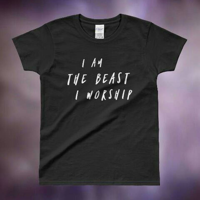 May include: Black t-shirt with white text that reads "I am the beast I worship".