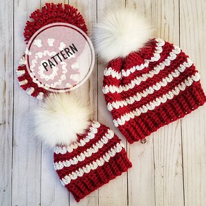 May include: Two red and white striped crochet hats with white pom poms. The hats are made with a chunky yarn and have a simple, classic design.
