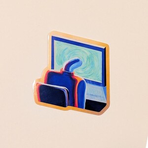 May include: A sticker featuring an abstract illustration of a person sitting at a computer. The person is depicted in blue, with an orange outline, and is seated in front of a computer screen with a swirling blue and green background. The sticker has a gold border.