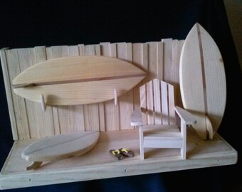 Taylor Made miniature surfboards with display and chair