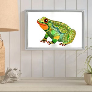 May include: A colorful, intricate illustration of a green frog with red eyes and orange accents. The frog is sitting on a white background and is surrounded by a silver frame.
