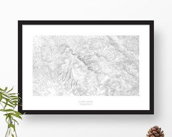 May include: A black and white topographic map print of Pikes Peak, Colorado. The print shows the elevation contours of the mountain. The text "Pikes Peak" and "Elevation 14,115 ft" is printed at the bottom of the map.