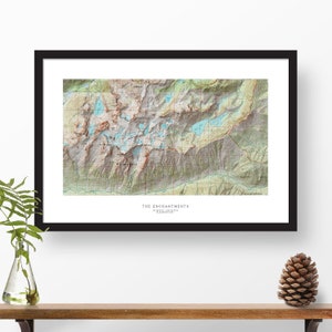 May include: A topographic map of The Enchantments, a mountain range in Washington state. The map shows the location of lakes, trails, and other features. The map is printed in black, white, and shades of green and blue.