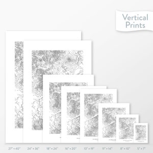 May include: A set of eight different sized prints of a topographic map. The prints are arranged in a row from largest to smallest, with the largest print measuring 27 inches by 40 inches and the smallest print measuring 5 inches by 7 inches. The prints are all white with black lines.