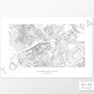 May include: A black and white topographic map print of the Columbia River Gorge. The map shows the elevation contours of the area. The print is 24 inches by 36 inches and is horizontal.