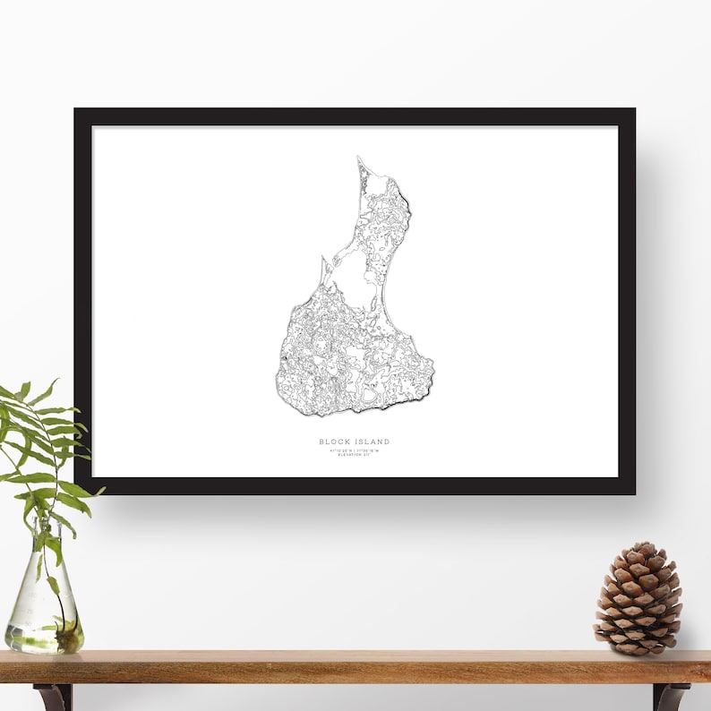 May include: A black and white line art print of Block Island, Rhode Island. The print is framed in a black frame and is hanging on a white wall.